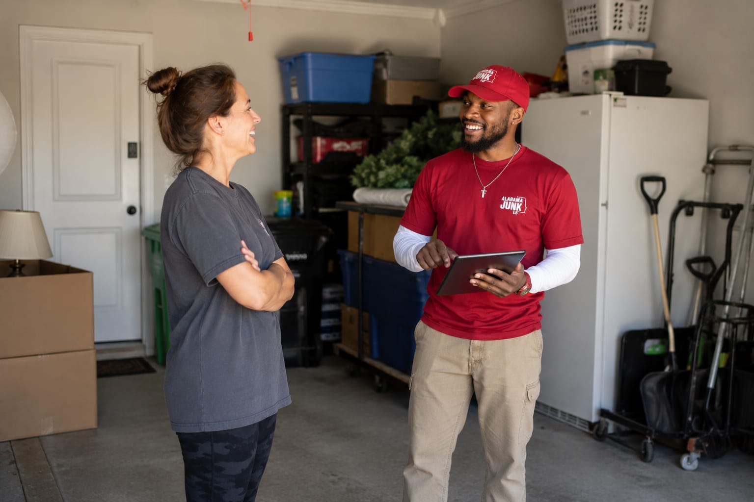 Alabama Junk Removal crew member with a customer in Birmingham